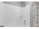 Bright bathroom with a well-maintained shower-tub combination and white fixtures at 4811 Nevilly Way, Marietta, GA 30066