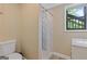 Bathroom featuring a shower with a clear glass door, tiled floor, and modern vanity at 4811 Nevilly Way, Marietta, GA 30066