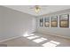 Bedroom features a ceiling fan and views from multiple windows at 4811 Nevilly Way, Marietta, GA 30066