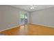 A light-filled bedroom with hardwood floors and sliding glass door leading to the deck at 4811 Nevilly Way, Marietta, GA 30066