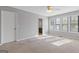 Bedroom featuring neutral colors, plush carpeting, and natural light from several windows at 4811 Nevilly Way, Marietta, GA 30066