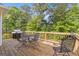 Wooden deck with outdoor seating, grill, and backyard view at 4811 Nevilly Way, Marietta, GA 30066