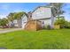 Side view of the home with inviting wooden deck and well-maintained lawn at 4811 Nevilly Way, Marietta, GA 30066