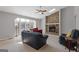 Cozy living room featuring a stone fireplace and ample natural light from large windows at 4811 Nevilly Way, Marietta, GA 30066