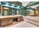 Relaxing primary bathroom with a sunken tub, double vanity, and large mirrors at 120 Hermitage Pl, Peachtree City, GA 30269
