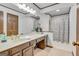 Bathroom featuring a neutral palette, vanity area with a decorative plant, and a shower with curtain at 120 Hermitage Pl, Peachtree City, GA 30269