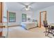 Spacious bedroom with two windows and ceiling fan at 120 Hermitage Pl, Peachtree City, GA 30269