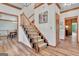 Entryway with a staircase featuring wood and carpet steps and wood floors at 120 Hermitage Pl, Peachtree City, GA 30269