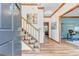 Inviting home foyer with hardwood floors, staircase, and views into adjacent living spaces at 120 Hermitage Pl, Peachtree City, GA 30269