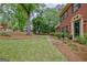 Brick home showing the lawn and entry. The front yard is well maintained at 120 Hermitage Pl, Peachtree City, GA 30269