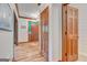 Hallway featuring wood trim, with wood doors and views of entryway at 120 Hermitage Pl, Peachtree City, GA 30269