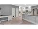 Well-lit kitchen featuring ample counter space, modern appliances, and tiled floor at 120 Hermitage Pl, Peachtree City, GA 30269