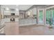 Bright kitchen features an island, stainless appliances, and access to an outdoor space at 120 Hermitage Pl, Peachtree City, GA 30269