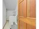Convenient laundry room with modern washer and dryer units and storage space at 120 Hermitage Pl, Peachtree City, GA 30269