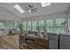Bright living room with wood-look floors, skylights, and many windows at 120 Hermitage Pl, Peachtree City, GA 30269