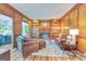 Classic living room with wood paneled walls, fireplace and built in shelving at 120 Hermitage Pl, Peachtree City, GA 30269