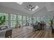 Bright living room with lots of natural light, skylights and wood-look floors at 120 Hermitage Pl, Peachtree City, GA 30269