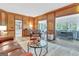 Open concept living room featuring hardwood floors and access to other rooms at 120 Hermitage Pl, Peachtree City, GA 30269