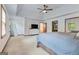 Spacious main bedroom features a tray ceiling, ceiling fan, and large windows for natural light at 120 Hermitage Pl, Peachtree City, GA 30269