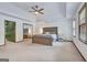 Large main bedroom with carpet, windows and a bed in the center of the shot at 120 Hermitage Pl, Peachtree City, GA 30269