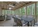 Screened patio with furniture and a ceiling fan at 120 Hermitage Pl, Peachtree City, GA 30269
