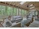 Screened patio with skylights, ceiling fan, and outdoor furniture at 120 Hermitage Pl, Peachtree City, GA 30269