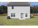 Spacious backyard featuring a well-maintained lawn and a home with a door and several windows at 432 Cantrell Drive, Dallas, GA 30157