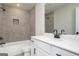 Modern bathroom with tiled shower, white vanity, and sleek black fixtures at 432 Cantrell Drive, Dallas, GA 30157