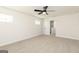 Bright bedroom with neutral carpet, ceiling fan, and a view into the hallway at 432 Cantrell Drive, Dallas, GA 30157