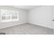 Cozy bedroom featuring neutral carpet, a window with blinds, and white walls at 432 Cantrell Drive, Dallas, GA 30157