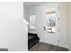 Bright entryway featuring hardwood floors, stairs to the upper level, and a door with glass panels at 432 Cantrell Drive, Dallas, GA 30157