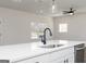 Modern kitchen island with stainless steel dishwasher and matte black sink fixtures at 432 Cantrell Drive, Dallas, GA 30157
