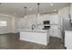 Modern kitchen with stainless steel appliances, white cabinetry, and a large kitchen island at 432 Cantrell Drive, Dallas, GA 30157