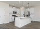Modern kitchen with white cabinets, stainless steel appliances, a central island, and pendant lights at 432 Cantrell Drive, Dallas, GA 30157