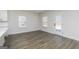 Open living space featuring hardwood floors, multiple windows, and access to an outdoor area at 432 Cantrell Drive, Dallas, GA 30157