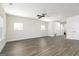 Open-concept living room with stylish floors, a modern ceiling fan, and abundant natural light at 432 Cantrell Drive, Dallas, GA 30157