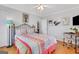 Comfortable bedroom featuring a decorative bed frame, desk and neutral decor at 300 Peachtree Ne Ave # 22N, Atlanta, GA 30305