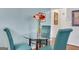 Cozy dining area features a glass table, seating for four, and stylish decor at 300 Peachtree Ne Ave # 22N, Atlanta, GA 30305