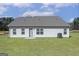Back exterior view features a level backyard and simplistic siding at 474 Cantrell Drive, Dallas, GA 30157