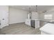Bright kitchen featuring stainless steel appliances, quartz countertops, and an island with bar seating at 474 Cantrell Drive, Dallas, GA 30157