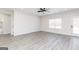 Large open living area with ceiling fan, and sliding glass door to the backyard at 474 Cantrell Drive, Dallas, GA 30157