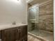 Bathroom featuring vanity and tiled walk in shower at 4806 Rockbridge Rd, Stone Mountain, GA 30083