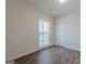 Bedroom with window letting in natural light and hard surface floors at 4806 Rockbridge Rd, Stone Mountain, GA 30083