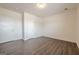 A bedroom featuring wood-look floors, white walls and a neutral color scheme at 4806 Rockbridge Rd, Stone Mountain, GA 30083