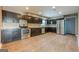 Spacious kitchen with stainless steel appliances, and dark cabinets at 4806 Rockbridge Rd, Stone Mountain, GA 30083