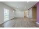 An open room with wood-look floors, white walls and recessed lighting at 4806 Rockbridge Rd, Stone Mountain, GA 30083