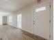 An open living room with white walls and wood-look floors, with natural light at 4806 Rockbridge Rd, Stone Mountain, GA 30083