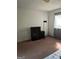 Bedroom with a black dresser, photography equipment, a neutral carpet, and a window at 79 Peyton Sw Pl, Atlanta, GA 30311