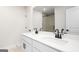 Bathroom features double sink vanity with quartz countertops and black faucets at 412 Cantrell Drive, Dallas, GA 30157