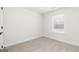 Bright bedroom featuring neutral carpet, a window with blinds, and fresh paint at 412 Cantrell Drive, Dallas, GA 30157